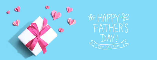 Wall Mural - Happy fathers day message with a gift box and paper hearts