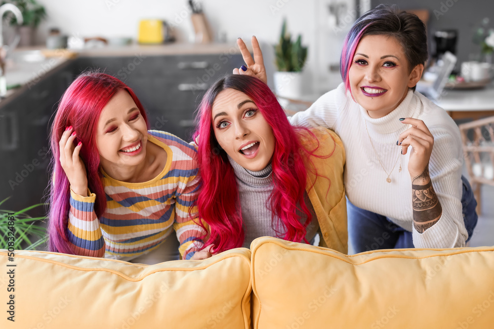 Beautiful women with bright hair having fun at home