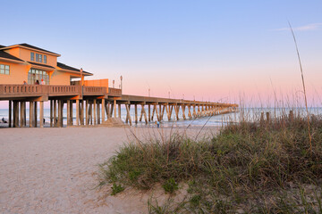 Wall Mural - Beautiful  sunset over Jennette's Pier , Nags Head North Carolina. Originally built in 1939, Jennette’s is the oldest fishing pier on the Outer Banks, NC USA