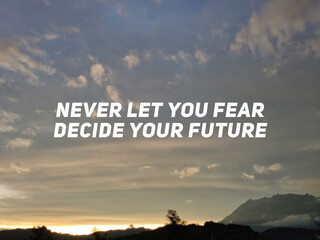 Motivational and inspirational quote - Never let your fear decide your future.
Text with sunset background.