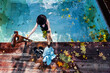 © Annatamila - Female wearing  swimsuit and  hat bathing in hot spring pool on sunny day. First frost autumn landscape, Kamchatka