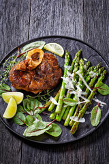 Wall Mural - braised osso buco with grilled asparagus, top view