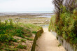 Beach access wooden pathway of atlantic sea in sand dunes with ocean in isle oleron island France southwest