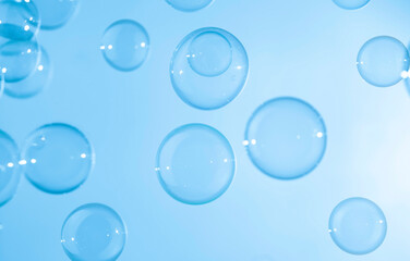 Wall Mural - Abstract Beautiful Transparent Blue Soap Bubbles Background. Soap Sud Bubbles Water	
