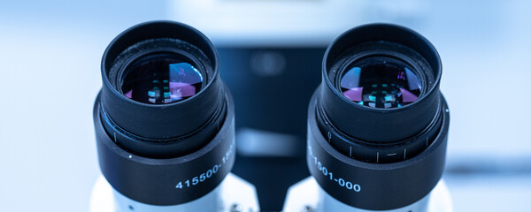 Wall Mural - Microscope eyepieces isolated in lab for study