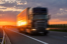 Truck On Highway During Spectacular Sunset,Intentional Motion Blur