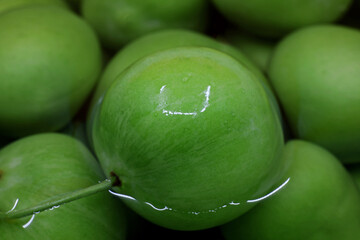 Wall Mural - close-up wet green fresh plums