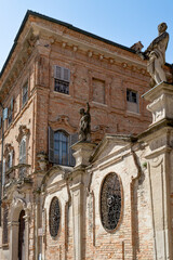 Wall Mural - The façade of Terni de' Gregorj Palace, built in 17th century in Baroque-style, with statues and terracotta cladding, in Crema city, Lombardy region, Italy