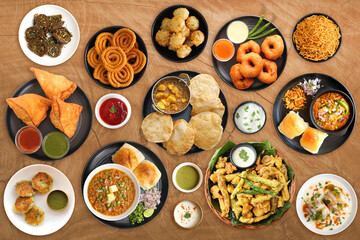 Assorted Indian snack dishes. Samosa, Pav Bhaji, Puri bhaji, Medu vada, Misal Pav, Pakode, Chakli, Sabudana vada, Alu vadi, Aloo tikki, Dahi Vada, Bhujiya. Vegetarian food banner. Copy Space Fast food