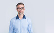 © be free - smiling mature ceo wear businesslike shirt and glasses on grey background