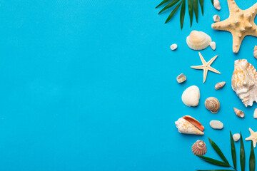 Summer time concept Flat lay composition with beautiful starfish and sea shells on colored table, top view with copy space for text