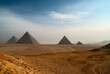 The great Egyptian pyramids. The deserted landscape with pyramids on Giza Plateau.
