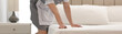 © New Africa - Young chambermaid making bed in hotel room, closeup. Banner design