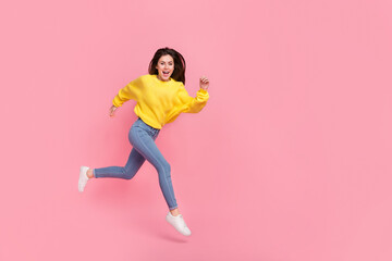 Poster - Full body profile side photo of young cheerful girl rush motion jump isolated over pink color background