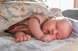 © KseniaJoyg - Portrait of a cute sleeping Caucasian newborn baby. Soft focus