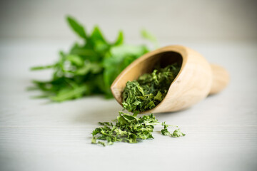 Wall Mural - dried green organic arugula, seasoning, on a light background