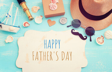 Wall Mural - Father's day and travel concept over blue wooden background. top view, flat lay