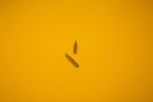 Small Screwdriver Bits On A Yellow Background