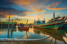 The Scenery Of Fishing Boats And The Evening Sky,Fishing Trawler At Sunset,Main Port For Travel Ship To Krabi And Phi Phi Island, Phuket, Thailand