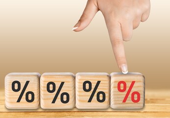 Sticker - Human hand choosing increasing percent  on wooden cubes.