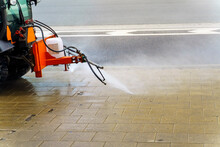Special Equipment Washes The Sidewalk With A Special Liquid