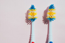 Old toothbrushes on background