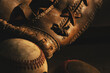 © ccestep8 - Golden light on old vintage baseball glove with ball close up for history of traditional sport.