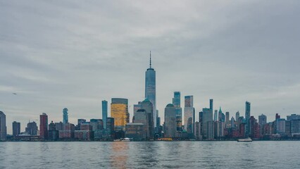 Fototapete - Downtown Manhattan skyline at dusk, New York city, timelapse of day to night transition, zoom in effect