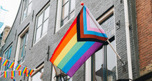 Modern Progress 2022 LGBTQ Pride Flag During Pride Month. Includes People Of Color. Rainbow Gay, Transgender And Queer Symbol For Equality. Celebration Of Pride Month