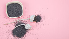 Composition With Poppy Seeds On Pink Background.