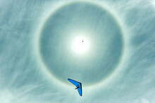 Hang Gliding With Sun Halo On A Beautiful Day