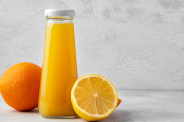 Wall Mural - Orange fruit and orange juice on wooden background