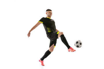 Wall Mural - Professional male football soccer player in motion and action isolated on white studio background. Concept of sport, goals, competition, hobby, world cup