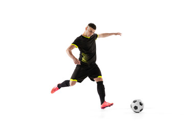 Sticker - Professional male football soccer player in motion and action isolated on white studio background. Concept of sport, goals, competition, hobby, world cup