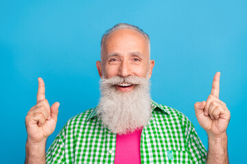 Sticker - Portrait of positive funky granddad indicate fingers up empty space blank isolated on blue color background