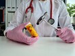 © Nadzeya - Neurologist holds medical pills and hammer for diagnosing neurological diseases
