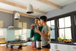 © Wavebreak Media - Diverse gay male couple drinking healthy smoothie together in the kitchen at home