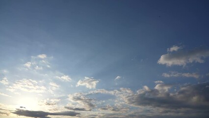 Wall Mural - 4k stock video timelapse of beautiful blue sky with soft white clouds isolated on sunny background. 