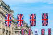 Rows of Union above Regent Street mark the Queen's Platinum Jubilee celebrations. Selective focus