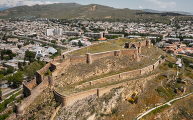 Wall Mural - Aerial view of Gori Fortress. It is a medieval citadel in Georgia, situated above the city of Gori on a rocky hill