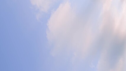 Wall Mural - fast moving colored clouds at sunrise vertical time lapse shoot. natural cloudscape timelapse backgr