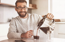 Attractive Man Pouring Himself A Cup Of Morning Coffee
