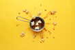 Caramel-sweet popcorn in a metal bowl. Caramel explosion. Yellow background. Photography for advertising cinemas, cafes, restaurants, coffee houses. Horizontal photo.