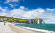 Panoramic view of the beach of Etretat in Normandy, a popular french seaside town known for its chalk cliffs