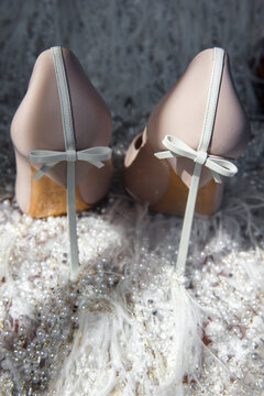 Ivory shoes on a wedding dress