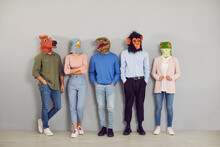 Funny Half People Half Animals Waiting By Office Wall Together. Group Portrait Company Workers, Students Or Job Applicants Wearing Extravagant Wacky Absurd Comedy Fancy Dress Carnival Masquerade Masks