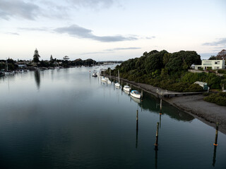 Wall Mural - Aerial view of Tamaki river (Auckland, New Zealand) with moored boats. Stock photo.