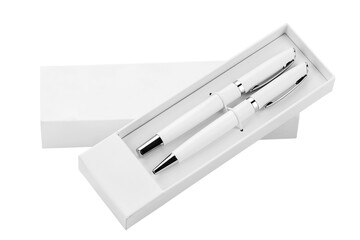 Wall Mural - Two white ballpoint pens in a box on a white background.