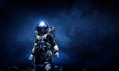 Wall Mural - astronaut walking on an unexplored planet
