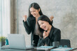 © Kritdanai - Asian woman sitting at a desk working in the office use a computer, laptop